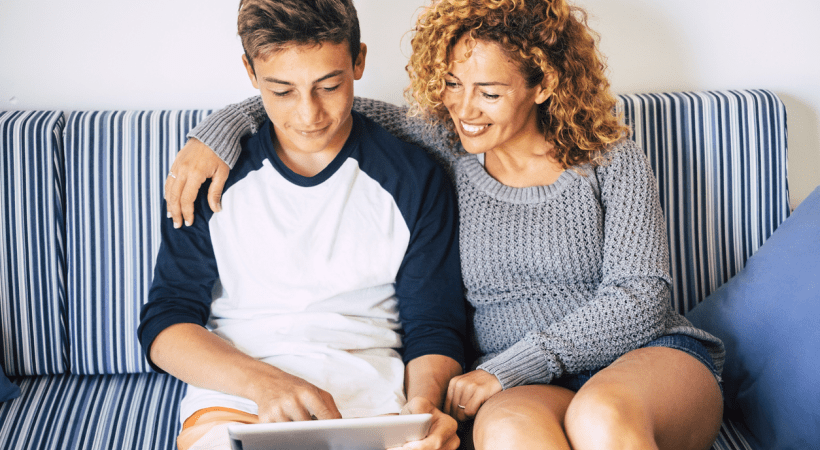 Mum helping teenage boy study